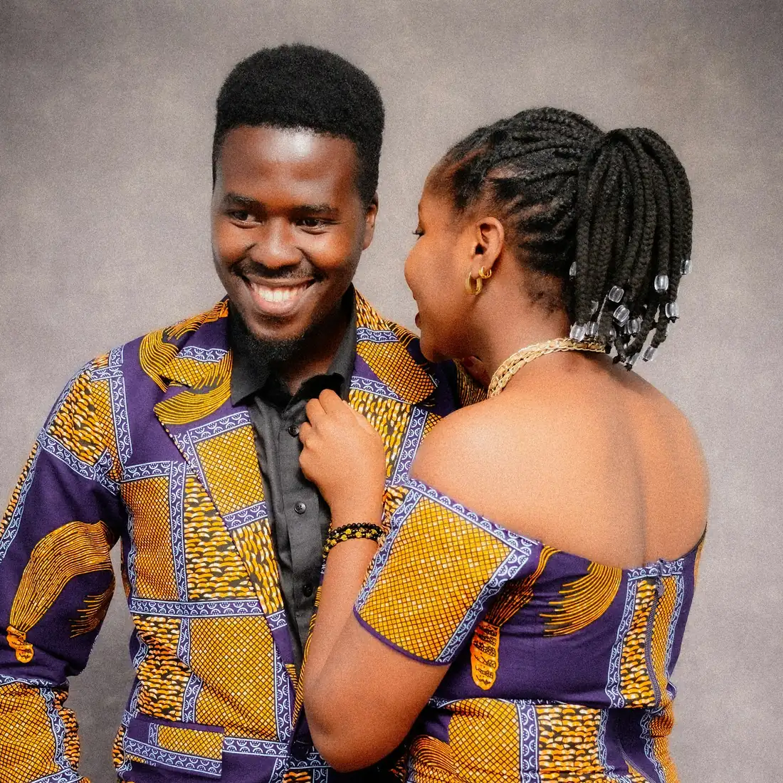 A happy couple in kitenge outfits
